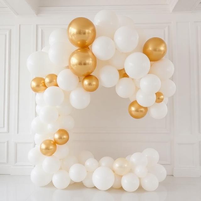 Elegant wedding balloon arrangement with white, cream #F9F7F3 and metallic gold #D4AF37 balloons, minimal, airy, romantic, photographed indoors with lots of white space